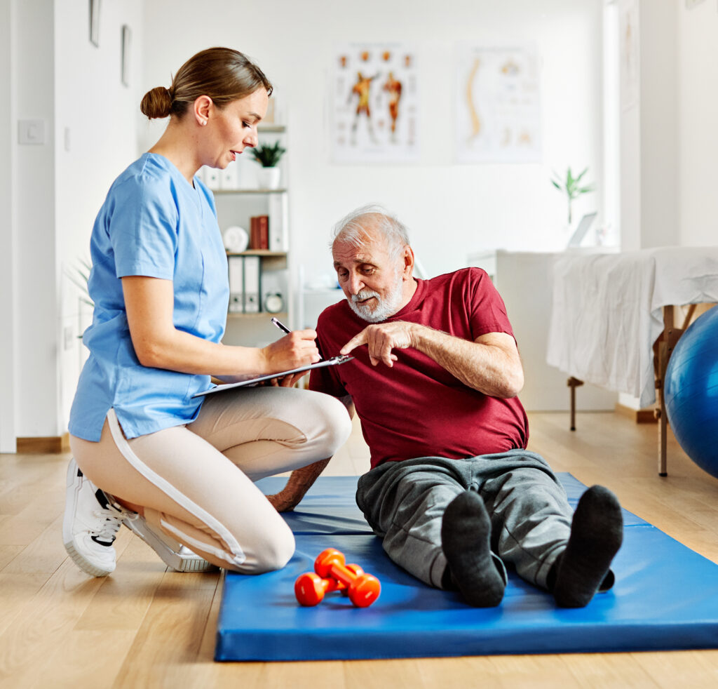 nurse doctor senior care exercise physical therapy exercising help assistence retirement home physiotherapy strech band clinic therapist elderly man